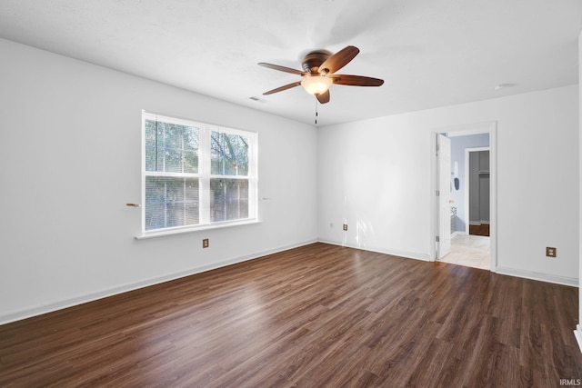 325 W Persimmon Ct, Bloomington, IN 47403 - empty room featuring a ceiling fan, wood finished floors, and baseboards