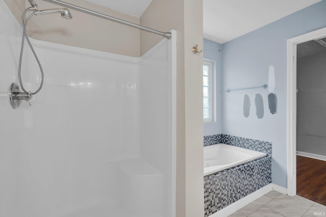 325 W Persimmon Ct, Bloomington, IN 47403 - bathroom featuring a garden tub, a shower, and marble finish flooring