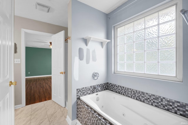 325 W Persimmon Ct, Bloomington, IN 47403 - full bath with a whirlpool tub, baseboards, and a ceiling fan