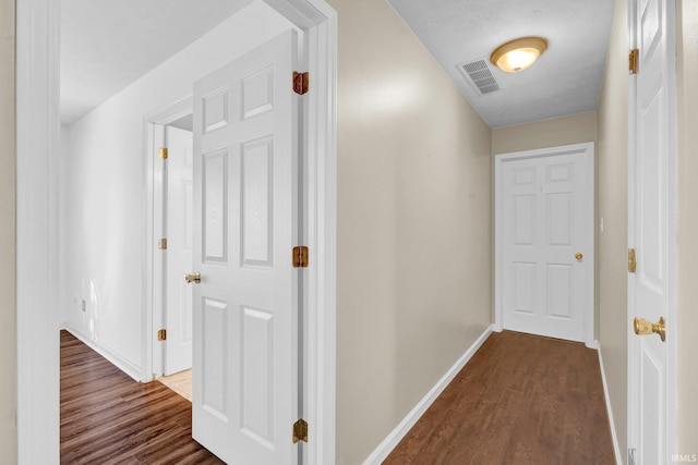 325 W Persimmon Ct, Bloomington, IN 47403 - hallway featuring baseboards and dark wood-style flooring