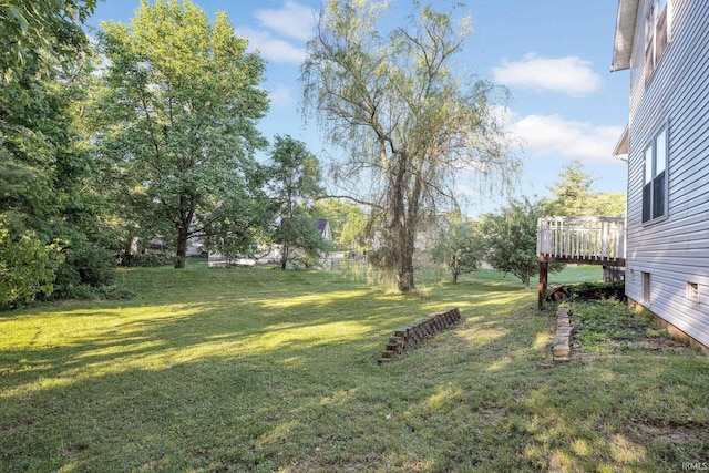 325 W Persimmon Ct, Bloomington, IN 47403 - view of green lawn featuring a wooden deck