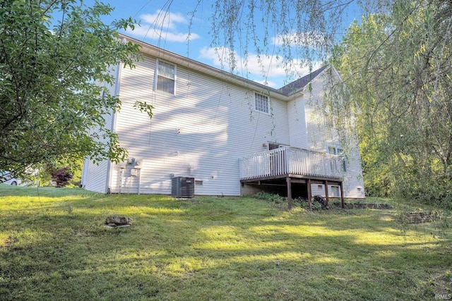 325 W Persimmon Ct, Bloomington, IN 47403 - rear view of house with cooling unit, a deck, and a lawn