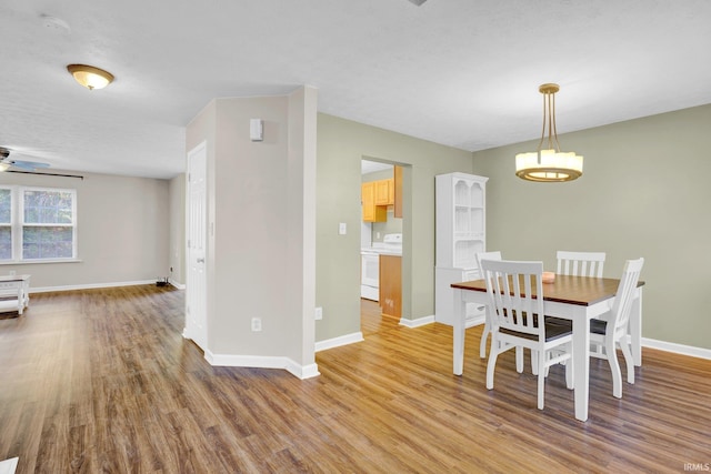 325 W Persimmon Ct, Bloomington, IN 47403 - dining space featuring light wood-style floors, baseboards, and ceiling fan