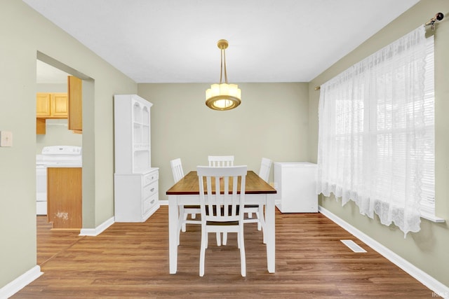 325 W Persimmon Ct, Bloomington, IN 47403 - dining space featuring light wood-style flooring, baseboards, and a chandelier