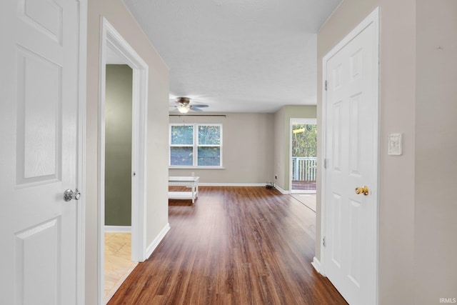 325 W Persimmon Ct, Bloomington, IN 47403 - hallway featuring dark wood-style flooring and baseboards
