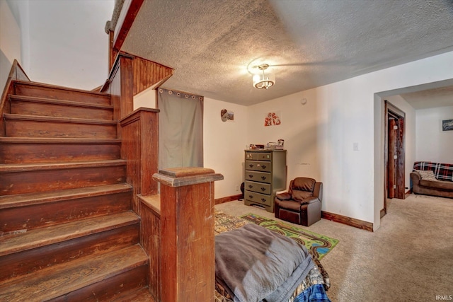 408 S Sale St, Ellettsville, IN 47429 - stairway featuring carpet floors, a textured ceiling, and baseboards