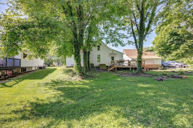 408 S Sale St, Ellettsville, IN 47429 - view of grassy yard featuring a deck
