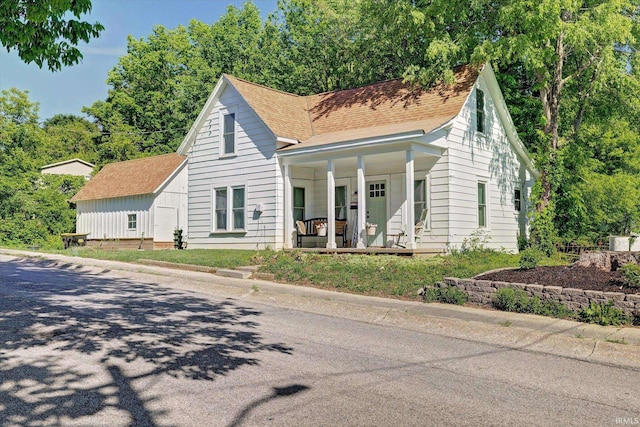 408 S Sale St, Ellettsville, IN 47429 - view of front of home with covered porch and roof with shingles