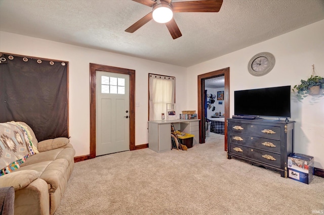 408 S Sale St, Ellettsville, IN 47429 - carpeted living room featuring a textured ceiling, ceiling fan, and baseboards