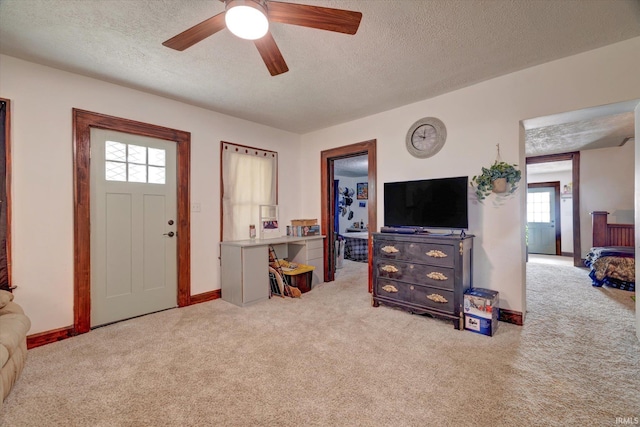 408 S Sale St, Ellettsville, IN 47429 - entryway featuring carpet, a textured ceiling, ceiling fan, and baseboards