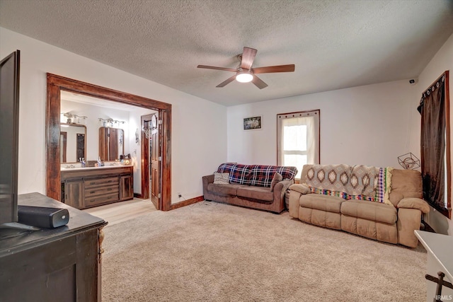 408 S Sale St, Ellettsville, IN 47429 - living area featuring light carpet, a ceiling fan, a textured ceiling, and baseboards