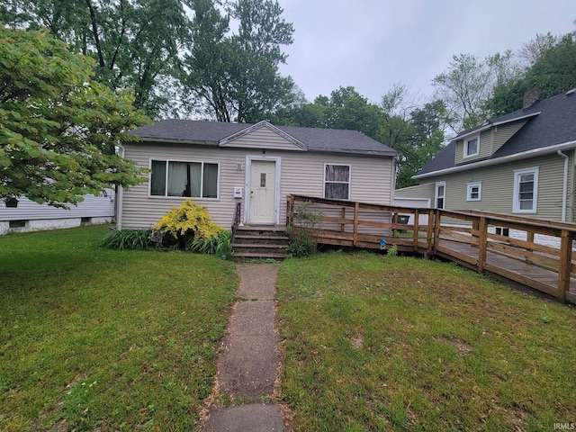 234 Alfred St, Elkhart, IN 46516 - view of front of house featuring a front yard and a wooden deck