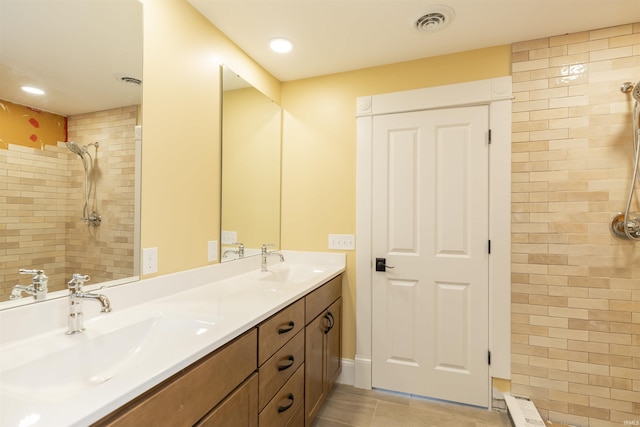 324 W Mishawaka Ave, Mishawaka, IN 46545 - full bath with double vanity, tiled shower, and tile patterned flooring