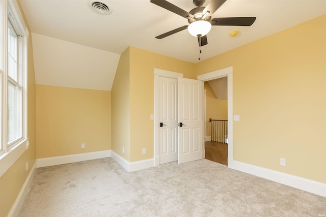 324 W Mishawaka Ave, Mishawaka, IN 46545 - unfurnished bedroom featuring carpet floors, multiple windows, and ceiling fan
