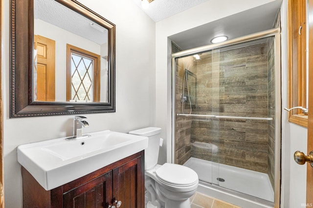 5318 Bedrock Ct, Fort Wayne, IN 46825 - bathroom with toilet, a shower stall, vanity, a textured ceiling, and tile patterned floors