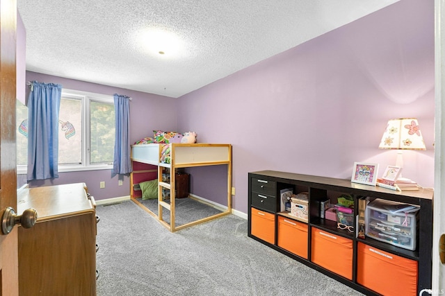 5318 Bedrock Ct, Fort Wayne, IN 46825 - carpeted bedroom with baseboards and a textured ceiling