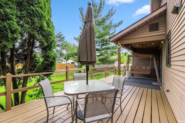 5318 Bedrock Ct, Fort Wayne, IN 46825 - wooden deck featuring outdoor dining area