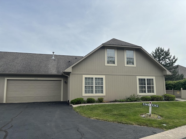 5242 Coventry Ln, Fort Wayne, IN 46804 - view of front of house with asphalt driveway, a garage, and a shingled roof