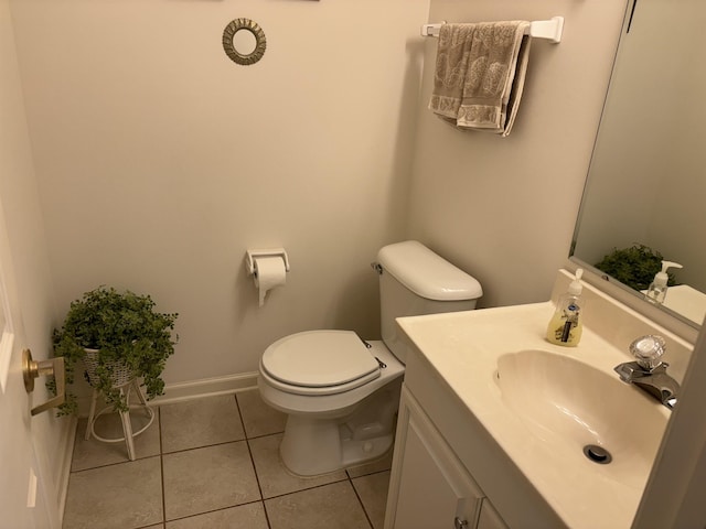5242 Coventry Ln, Fort Wayne, IN 46804 - half bathroom with toilet, tile patterned flooring, vanity, and baseboards