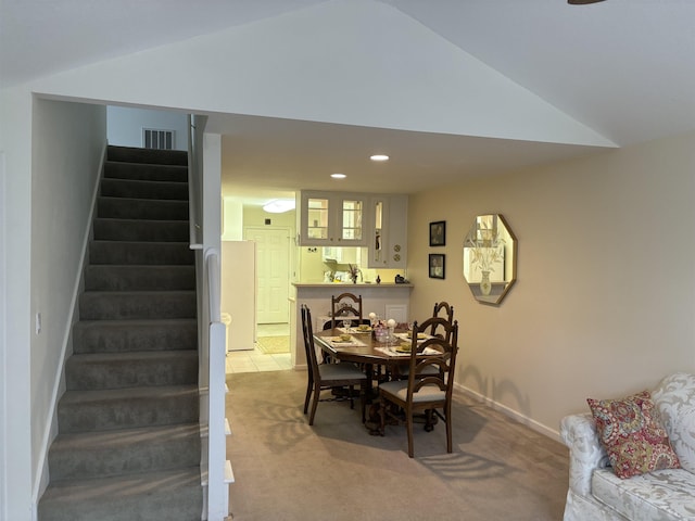 5242 Coventry Ln, Fort Wayne, IN 46804 - dining area with vaulted ceiling, stairs, carpet, recessed lighting, and baseboards