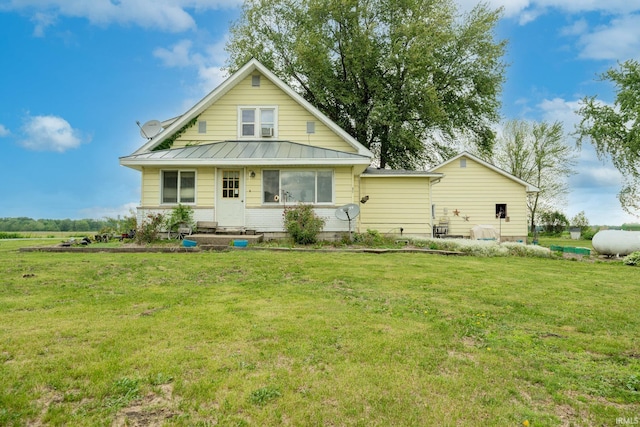 5026 N 450 W, Royal Center, IN 46978 - rear view of property featuring a lawn, a standing seam roof, and metal roof