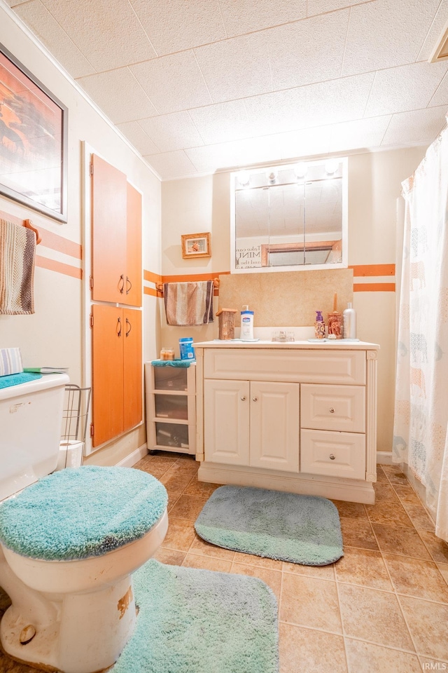 5026 N 450 W, Royal Center, IN 46978 - full bath featuring vanity, toilet, curtained shower, tile patterned flooring, and baseboards