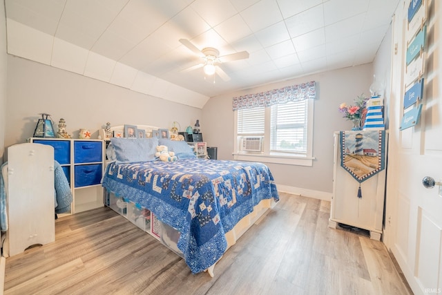 5026 N 450 W, Royal Center, IN 46978 - bedroom featuring wood finished floors, ceiling fan, cooling unit, and baseboards