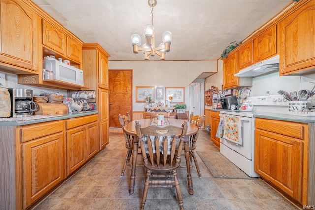5026 N 450 W, Royal Center, IN 46978 - kitchen featuring white appliances, under cabinet range hood, a chandelier, light countertops, and decorative light fixtures