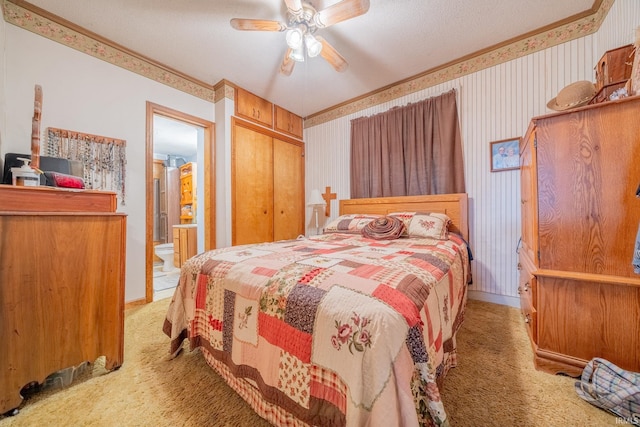 5026 N 450 W, Royal Center, IN 46978 - bedroom featuring light carpet, wallpapered walls, a closet, crown molding, and a textured ceiling