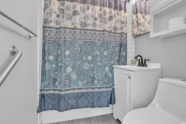 1122 Curdes Ave, Fort Wayne, IN 46805 - full bathroom featuring toilet, vanity, and wood finished floors