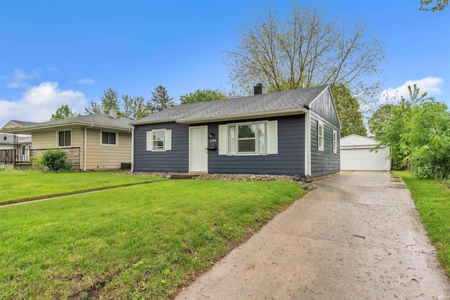 1122 Curdes Ave, Fort Wayne, IN 46805 - view of front facade with a garage, an outdoor structure, a front yard, and a chimney