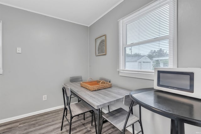 1122 Curdes Ave, Fort Wayne, IN 46805 - dining space featuring crown molding, wood finished floors, and baseboards