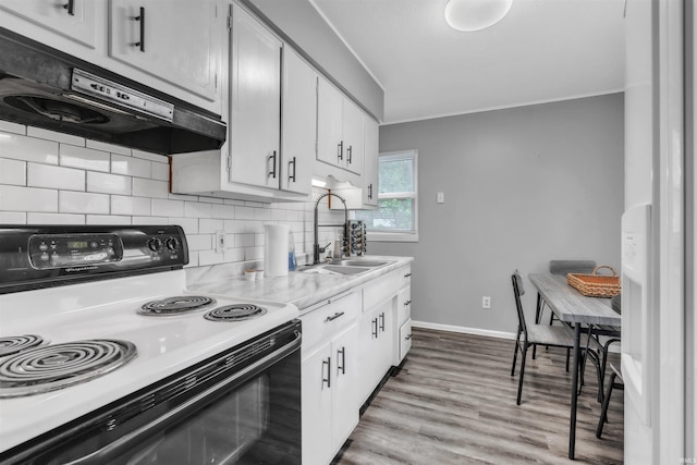 1122 Curdes Ave, Fort Wayne, IN 46805 - kitchen with range with electric cooktop, a sink, backsplash, light countertops, and ornamental molding