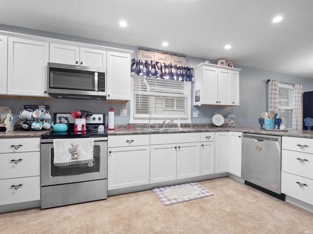 1346 Grayston Ave, Huntington, IN 46750 - kitchen with stainless steel appliances, a sink, white cabinetry, and recessed lighting