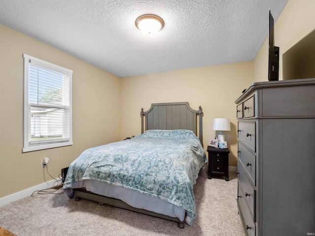 1346 Grayston Ave, Huntington, IN 46750 - bedroom with light colored carpet, a textured ceiling, and baseboards