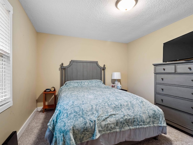 1346 Grayston Ave, Huntington, IN 46750 - carpeted bedroom with a textured ceiling and baseboards