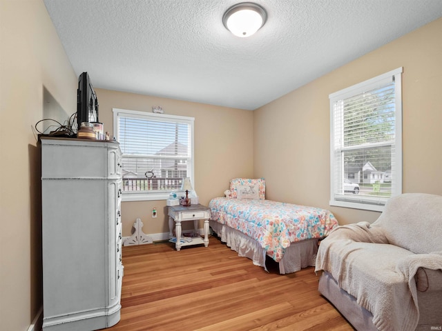 1346 Grayston Ave, Huntington, IN 46750 - bedroom with light wood-type flooring and a textured ceiling