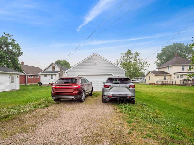 1346 Grayston Ave, Huntington, IN 46750 - view of front facade featuring a detached garage and a front lawn