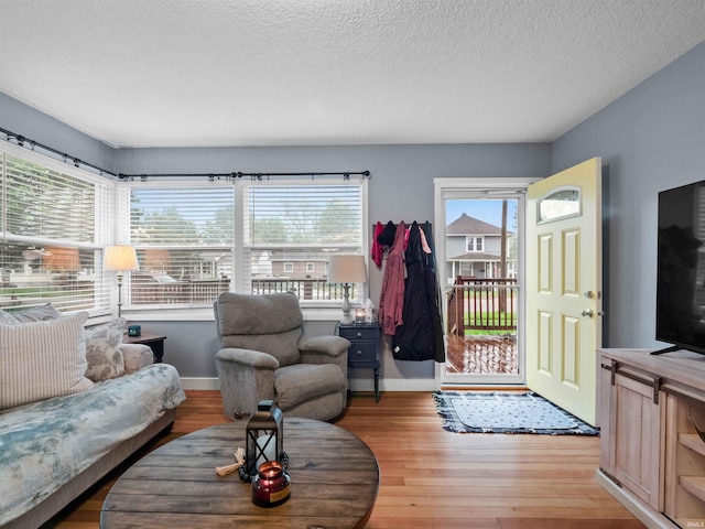 1346 Grayston Ave, Huntington, IN 46750 - living room featuring light wood-type flooring, baseboards, and a textured ceiling