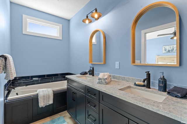 30860 Villa Dr, Granger, IN 46530 - bathroom with double vanity and a garden tub