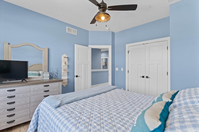 30860 Villa Dr, Granger, IN 46530 - bedroom featuring a closet, a ceiling fan, and wood finished floors