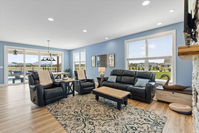 30860 Villa Dr, Granger, IN 46530 - living area featuring light wood-type flooring, recessed lighting, and a chandelier