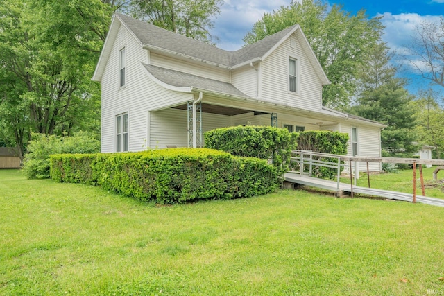20 E Little St, Denver, IN 46926 - view of side of property featuring a lawn and roof with shingles
