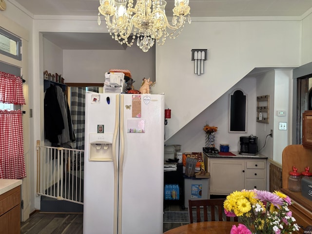451 Miller Ave, Clarksville, IN 47129 - kitchen with white fridge with ice dispenser, a chandelier, and wood finished floors