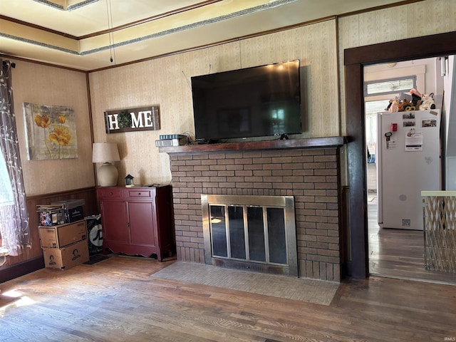 451 Miller Ave, Clarksville, IN 47129 - living area with wood finished floors, a brick fireplace, and crown molding
