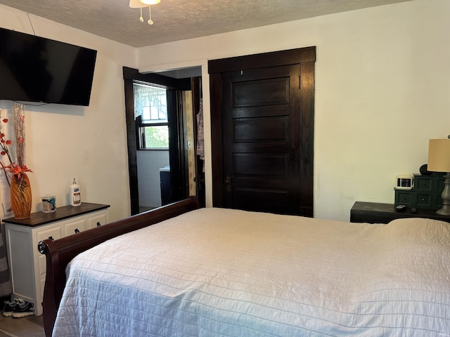 451 Miller Ave, Clarksville, IN 47129 - bedroom featuring a textured ceiling and wood finished floors