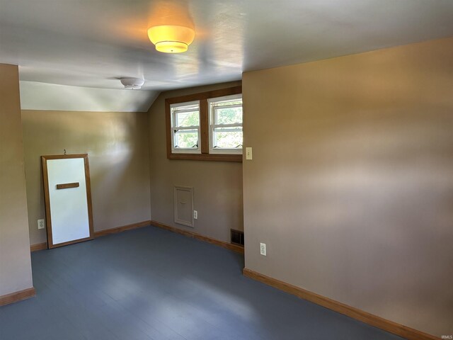451 Miller Ave, Clarksville, IN 47129 - unfurnished room featuring baseboards, vaulted ceiling, and wood finished floors