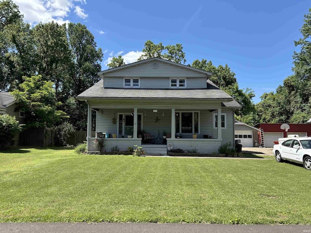451 Miller Ave, Clarksville, IN 47129 - view of front of house with a porch, a front yard, a shingled roof, and a garage