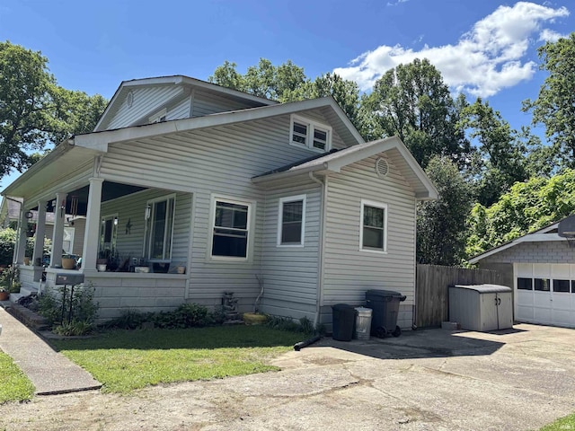 451 Miller Ave, Clarksville, IN 47129 - view of front of house featuring a porch, concrete driveway, and a garage