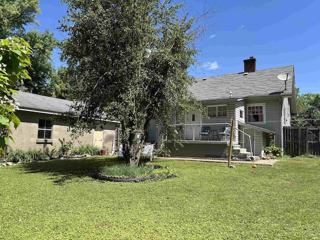 451 Miller Ave, Clarksville, IN 47129 - back of house featuring a chimney and a shingled roof